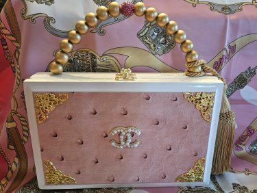 CC Pearl Brooch on Pink Ostrich Cigar Box Purse