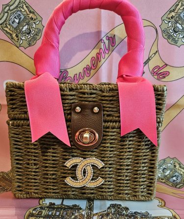 CC Brooch on Brown Rattan Handbag
