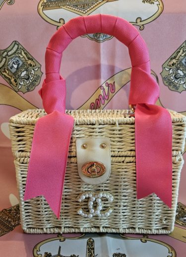 CC Brooch on Cream Rattan Handbag